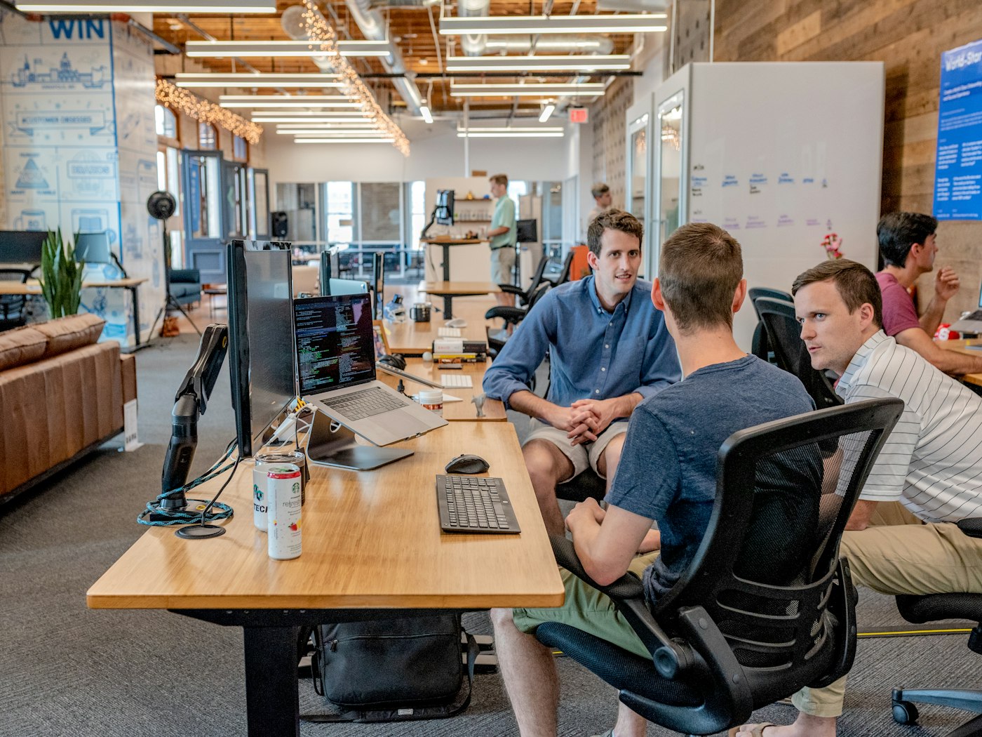 Colleagues collaborating in a modern occupied office building